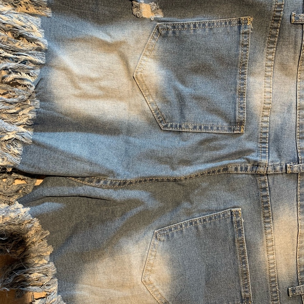 Denim  distressed shorts with sparkle tassels